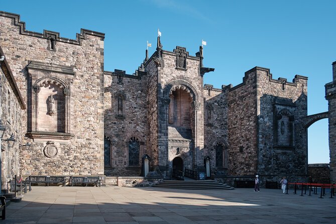 Edinburgh Castle Guided Walking Tour & Holyrood Palace Ticket - Edinburgh Castle at your first stop: Castle Rock, Great Hall, and Royal Apartments