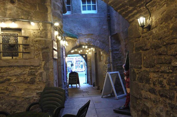 Highlights from the Royal Mile: A Self-Guided Audio Tour - Mercat Cross area tales, mobs, and public punishment