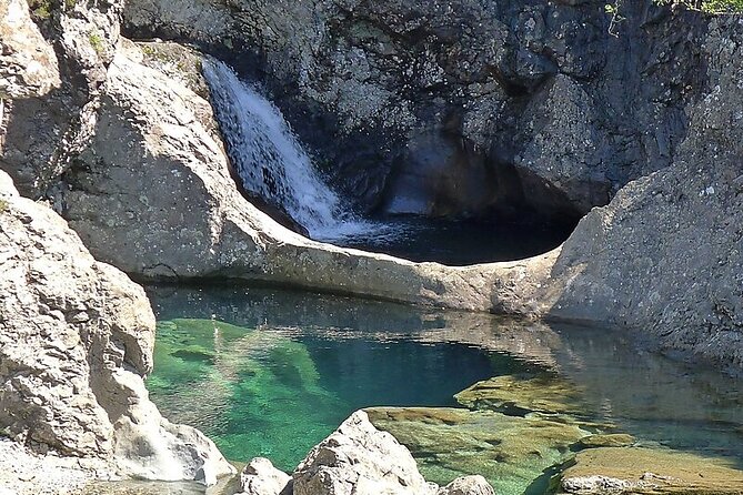 Private Tour to Skye, Fairy Pools, Portree and The Fairy Glen - Eilean Donan Castle: a classic photo stop without the full commitment