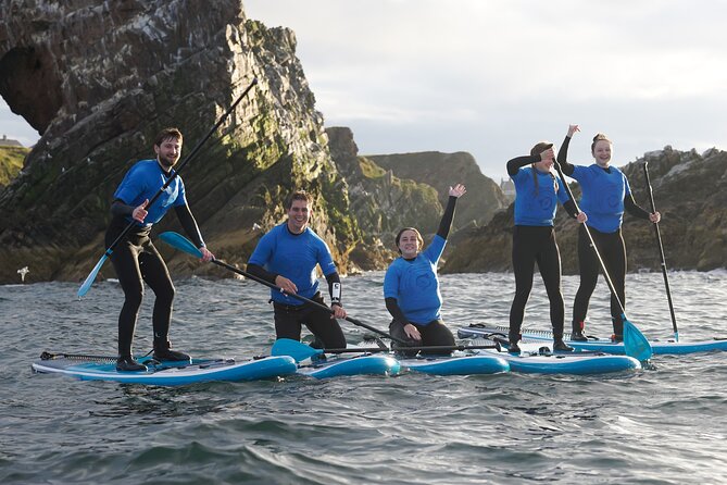 Stand Up Paddleboarding Lesson in Historic Portknockie Harbour - Kneeling control, then feet: the core lesson progression